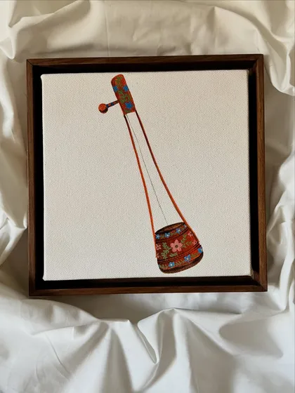 A miniature painting of an Ektara, a single-stringed instrument, from 'The Twenty-Fifth Note' collection. The detail in the small canvas celebrates the beauty of traditional instruments.