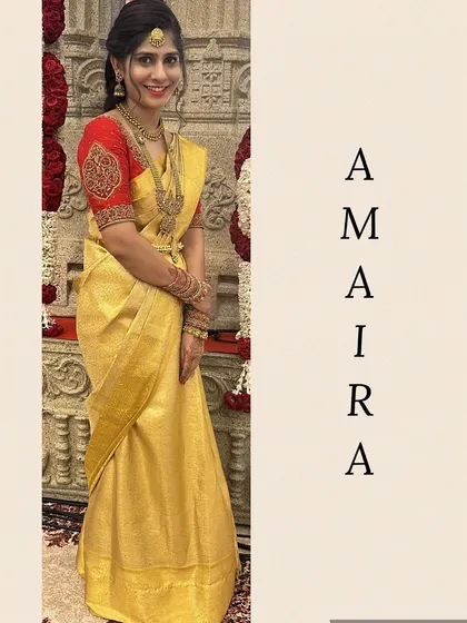 Another angle of this elegant bridal outfit, showing how the custom red blouse with detailed sleeve work stands out against the pure yellow Kanjivaram silk.