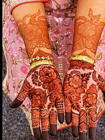 A collection of photos showing the gorgeous results of my henna, from a lighter orange stain to a deep, rich maroon.
