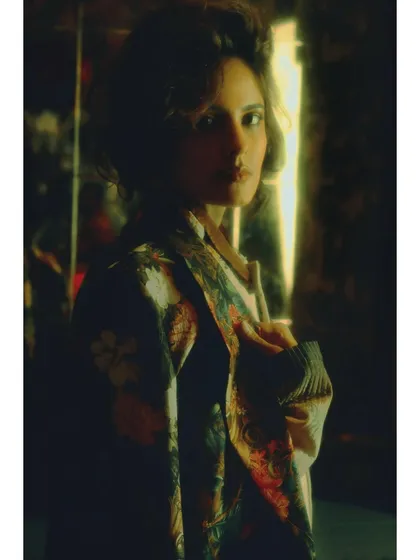 A final, intimate portrait from the series. The styling is sharp, and the model's gaze is direct, suggesting she has finally found her place in the present.