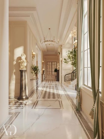 I use light and architecture to create rhythm in long spaces. This corridor features a striking checkerboard marble runner, classical busts on pedestals, and elegant wall sconces that guide the eye and create a sense of procession and grandeur.