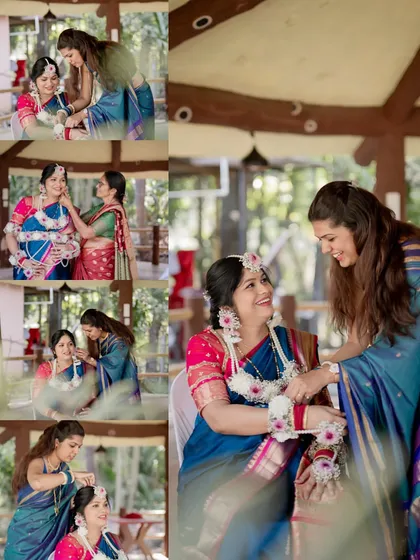 Capturing the beautiful rituals and candid moments with family members. Here, a guest helps the mother-to-be with her floral jewelry during the Dohale Jevan ceremony.