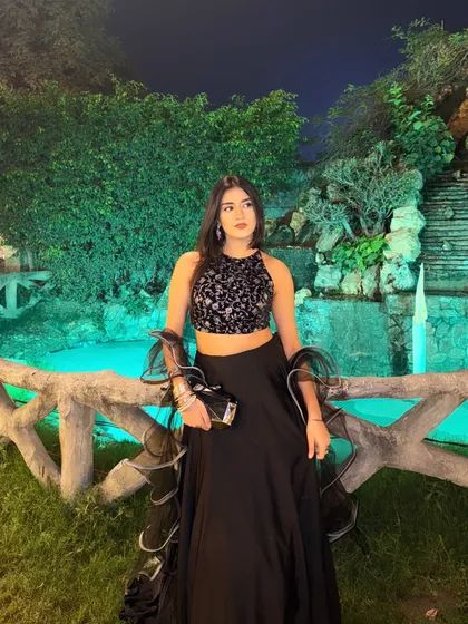 Another full-length pose, showcasing the modern and chic vibe of this wedding season outfit.