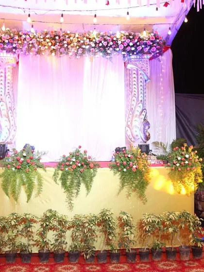 Our attention to detail is visible in every element of our stage designs. This elegant stage for an awards night features a beautiful floral valance, soft drapery, and lush greenery, creating a sophisticated backdrop for speakers and awardees.