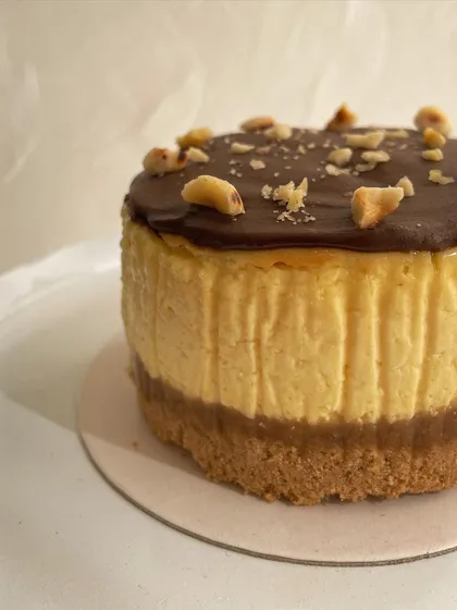 Rich, creamy, and nutty. Our eggless Nutella Baked Cheesecake features a classic biscuit base, a smooth baked cheesecake filling, and a decadent topping of Nutella and toasted hazelnuts.