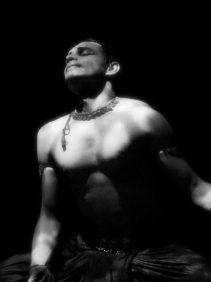 Another expressive black and white image from 'Nagamandala', focusing on the emotion conveyed through posture and light.