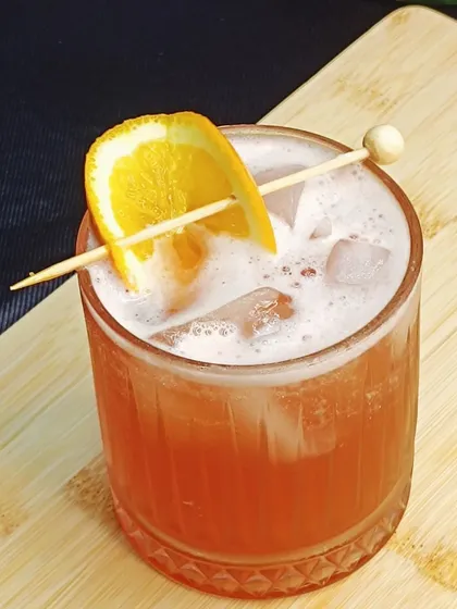 Another look at the Whisky Scarlett, a vibrant and easy-drinking cocktail perfect for any party. The mix of juices makes it a crowd-pleaser.