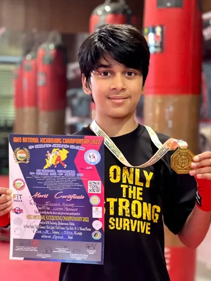 Erhaan Ansari proudly displays his Gold Medal and certificate from the IAKO National Kickboxing Championship. A future star.