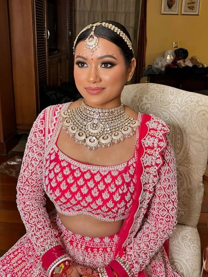 For my bong beauty Rubina, we did a classic matte smokey eye paired with a blush pink lip to complement her red and white embroidered lehenga.
