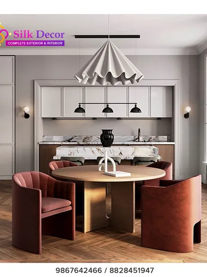 Our custom work extends to dining spaces. Here, we designed a set of plush, curved dining chairs in a rich terracotta fabric to surround a modern wooden table. These chairs are crafted not just for style, but for exceptional comfort during long meals and conversations.