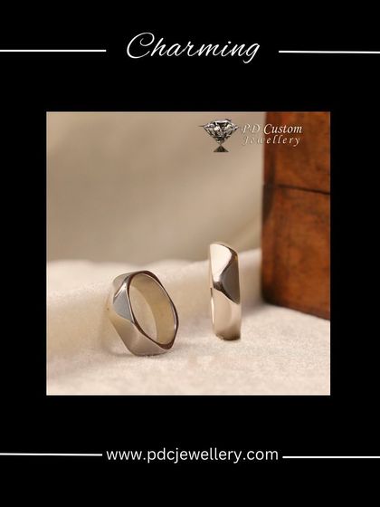 For the modern couple, these charming and minimalist bands are crafted in 14kt hallmark white gold. Their clean, geometric facets create a unique and sophisticated look that stands apart from traditional designs.