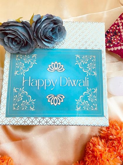 A lovely light blue gift box with a 'Happy Diwali' message, perfect for presenting smaller gifts or sweets.