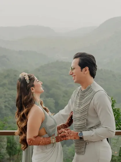 A happy, windswept moment with a beautiful mountain view. Destination weddings offer incredible opportunities for breathtaking couple portraits.