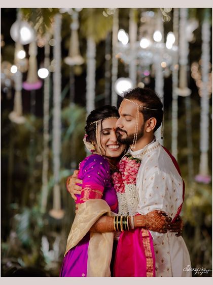 A warm, happy hug between the newly married couple.