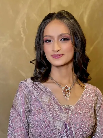 A close-up of the soft glam Sangeet makeup. The pink and lilac tones on the eyes create a dreamy, ethereal effect.