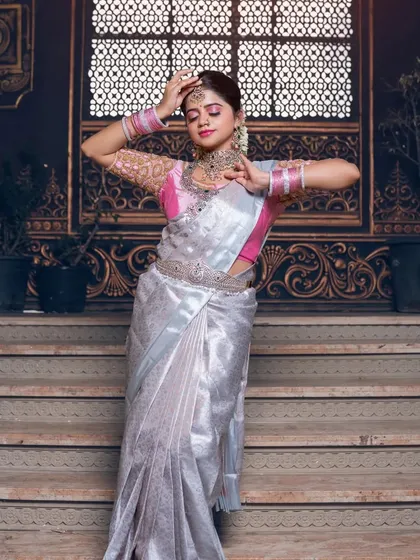 A full-length shot showing the graceful dance-like pose.