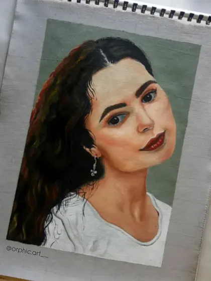 A finished oil portrait of a woman with long, dark hair. This was a study in capturing a soft expression and the subtle play of light and shadow on the face.