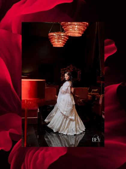 An elegant portrait of a bride-to-be, framed by a dramatic red floral border.