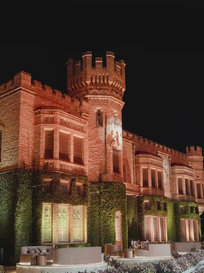 The castle lit up at night, creating a truly magical and enchanting backdrop for the reception.