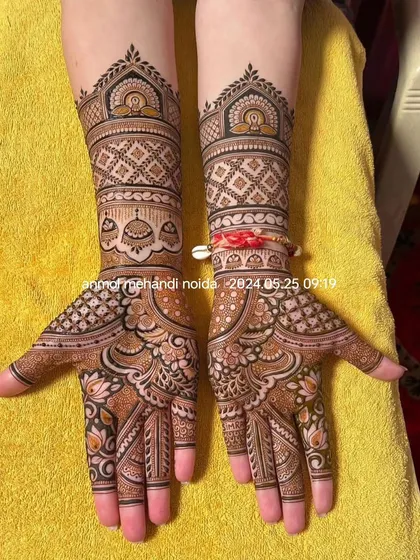 A clean and elegant design with geometric jaali patterns on the arms and delicate lotus motifs on the palms. The red sacred thread (kalava) adds a traditional touch to the overall look.