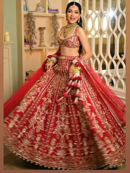The joy on a bride's face is everything. Here, the lehenga drape is both elegant and functional, allowing her to feel completely at ease and radiant.