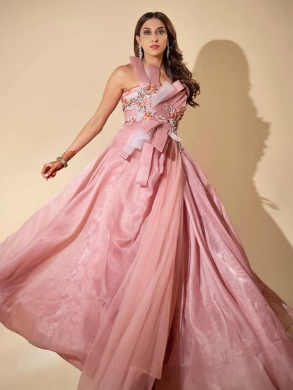 This shot captures the movement and flow of the gown. The makeup remains flawless and elegant, proving its staying power through a night of fun and dancing.