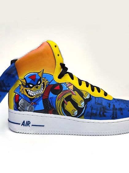 Who remembers Bade Meow and Chhote Meow? A maximalist, fully painted pair of SWAT Kats custom Nike Air Force 1s, for the ultimate 90s cartoon fan.