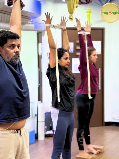 Strength and stability in action. Participants in our workshop use props to find proper alignment and build foundational strength in standing poses.