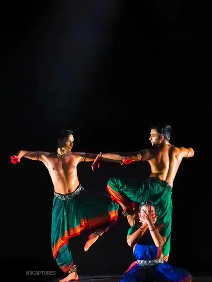 A complex formation from 'Nagamandala', where the dancers' bodies are intertwined to tell the story. This type of physical storytelling is a hallmark of our Punyah Dance Company productions.