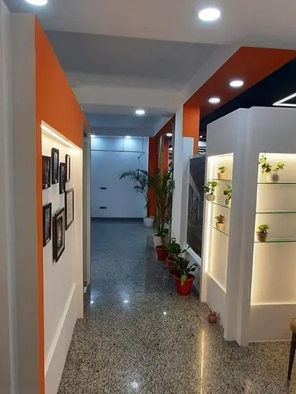 The clean and well-lit hallway of our Gulmohar Park clinic connects our consultation rooms and therapy areas. We prioritize a calm and organized environment for all our patients.