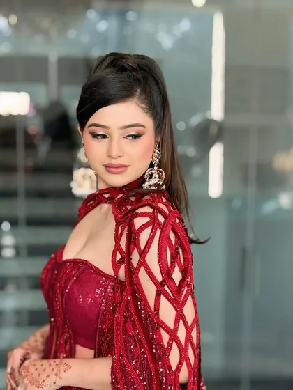 This modern engagement look is all about making a statement. I paired a sharp winged eyeliner and a high ponytail with flawless, glowing skin for a chic and contemporary party style.