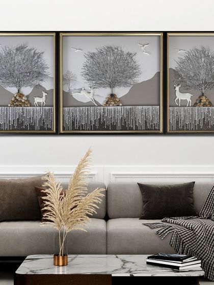 This serene, three-panel shadow box depicts a silver Tree of Life in a tranquil landscape with deer. The monochromatic color scheme and 3D elements create a peaceful and sophisticated piece of art.