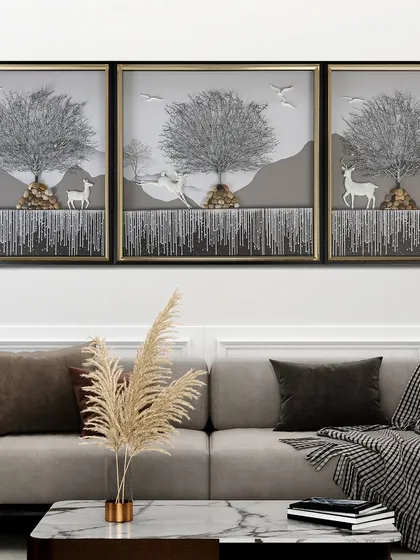 This serene, three-panel shadow box depicts a silver Tree of Life in a tranquil landscape with deer. The monochromatic color scheme and 3D elements create a peaceful and sophisticated piece of art.