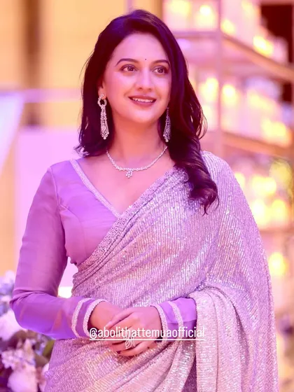 It was a pleasure creating this glamorous look for the talented actress Tejashree Pradhan. We opted for soft, wavy hair and a radiant makeup look with a hint of shimmer to complement her stunning sequined saree, perfect for a high-profile evening event.