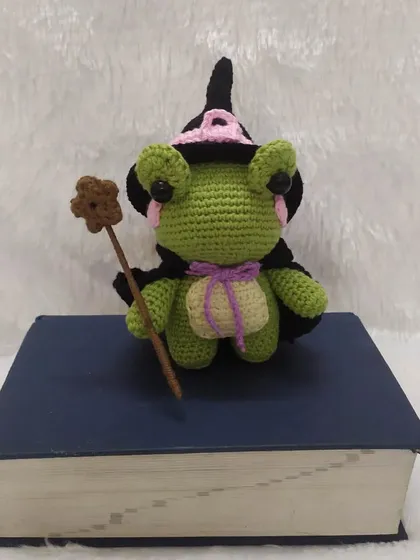 This little wizard frog is busy with his spellbook. I love getting creative and making unique characters like this one. He comes complete with a little hat, cape, and magic wand.