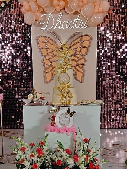 It was a privilege to design this butterfly-themed 3rd birthday for the great-granddaughter of our honorable Ex-Prime Minister, Shri H.D. Devegowda. The setup features a sequin backdrop and a stunning butterfly centerpiece.