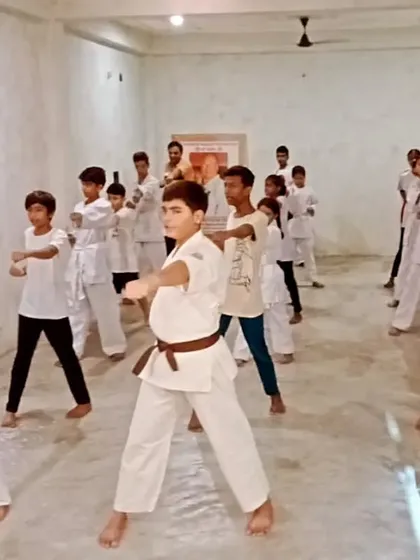 The mix of belts in this photo shows that junior and senior students train together, learning from each other.