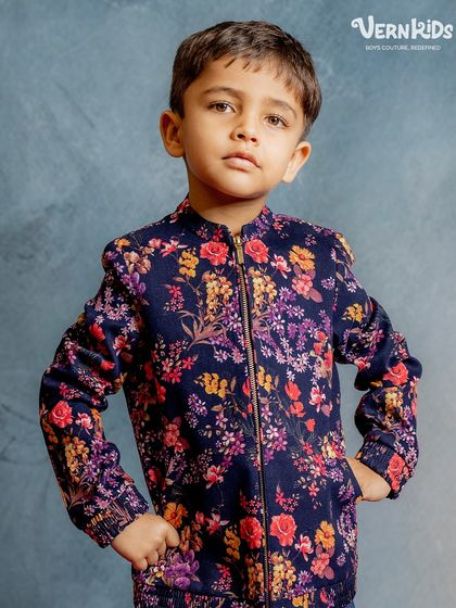 A close-up of our navy floral bomber. The rich colors and detailed floral pattern make this a standout piece, crafted for comfort and ultimate coolness.