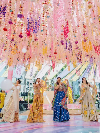 The bride and her squad showing off their moves at a colorful Mehendi carnival. We capture the choreographed dances as well as the spontaneous moments of joy.