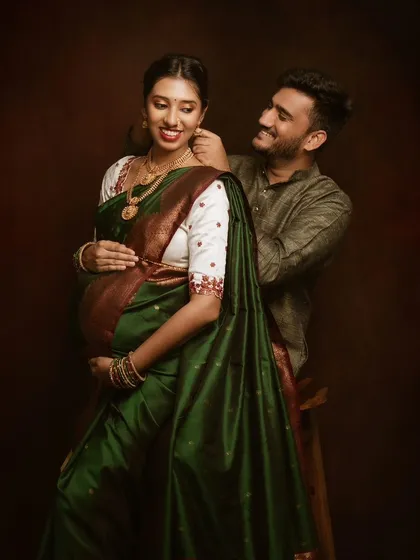 Tradition holds so much beauty and grace. For this fine art maternity session, we focused on the elegance of the rich green saree and the tender connection between the couple, creating a portrait that feels both timeless and deeply personal.