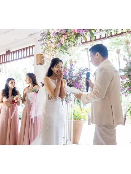Shachi is overcome with emotion as Nick says his vows. Her bridesmaids look on with support, creating a beautiful and heartfelt moment during the ceremony.