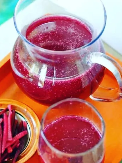 A pitcher of my fresh Kaanji, a traditional fermented probiotic drink made from black carrots and beetroot. It's tangy, savoury, and great for digestion.