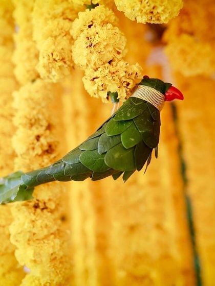 A close-up of one of the handmade leaf parrots, showcasing the creativity and attention to detail that goes into my traditional decor.