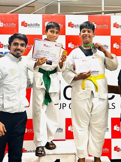 Two of my students on the podium after winning medals at the school games. Their success is my success.