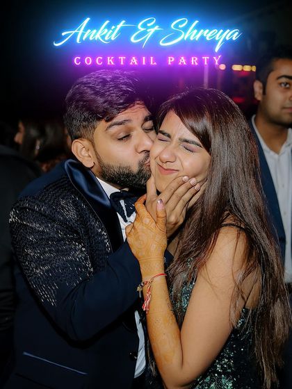 A playful and affectionate moment from the cocktail party, perfectly capturing the couple's fun-loving relationship.