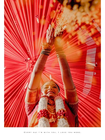 I love finding creative angles to capture traditional rituals. This unique perspective from below during the Akshata ceremony makes the moment feel even more special and immersive, highlighting the vibrant colors and emotions.