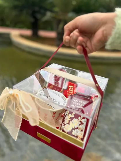 A "chai-rishta" themed hamper in a red velvet acrylic box, perfect for a tea lover.