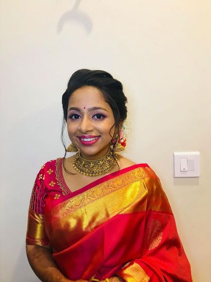 My beautiful bride Hyma, slaying her reception look in a classic red and gold silk saree. We opted for a soft glam makeup look and an elegant floral bun.