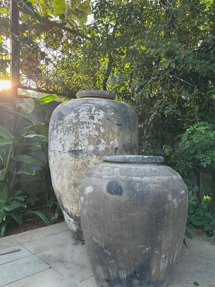 Another shot of the vintage planters, capturing the beautiful light and shadow on their textured surfaces.