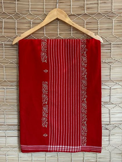 Another beautiful red handloom saree from our Chikankari series. The placement of the embroidered motifs adds a touch of elegance and grace to the classic drape.